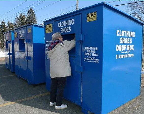 Elderly woman donating clothes to a Tennessee donation bin
