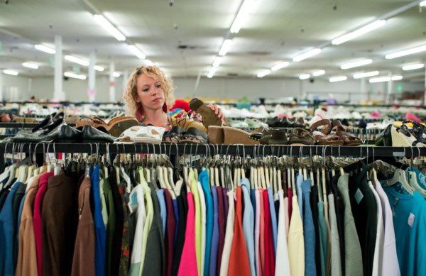 Woman shopping for clothes at a thrift store in California